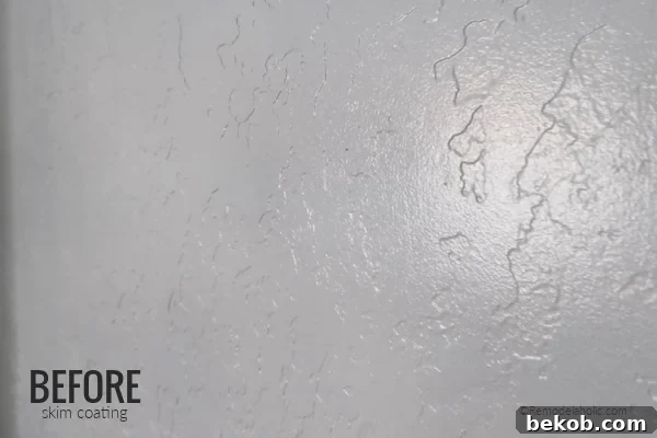Before How To Skim Coat Textured Walls To Make Them Smooth, Remodelaholic