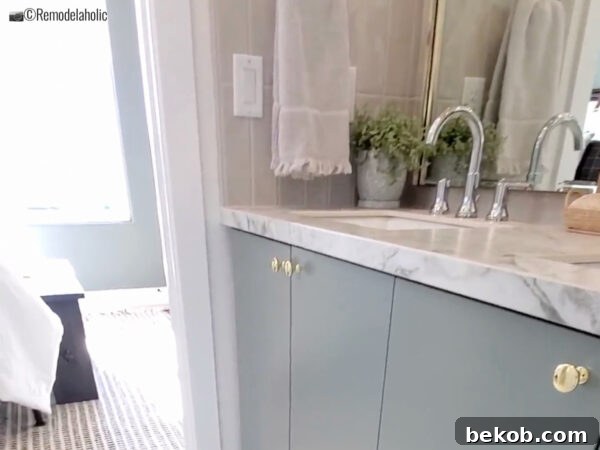Simple decorative touches add personality to a sleek Jack and Jill bathroom vanity.