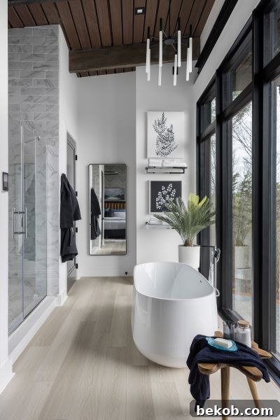 Primary Bathroom with Bath and Shower Overlooking a Valley