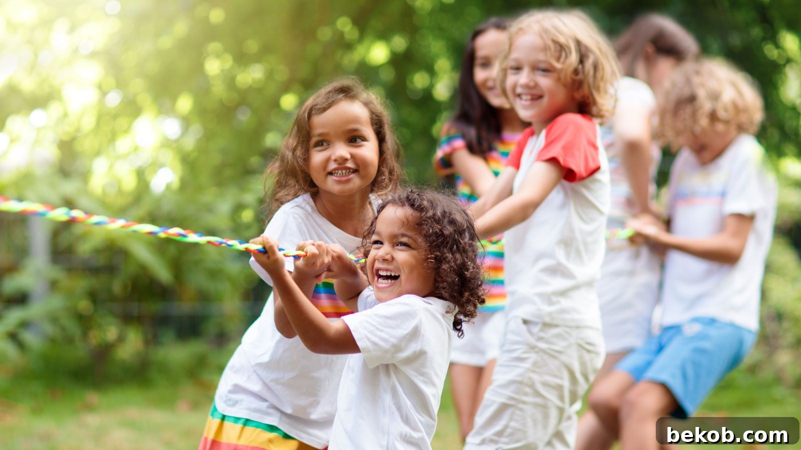 Kids joyfully playing giant yard games in a sunlit backyard.