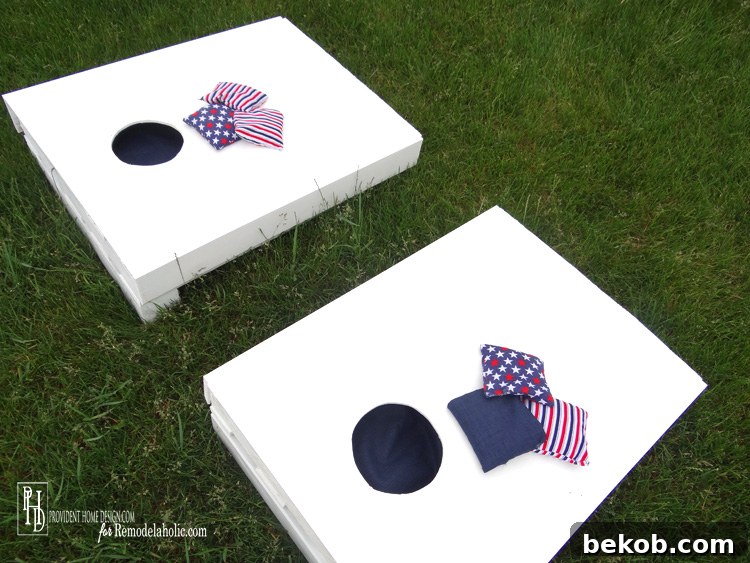 A charming, kid-sized cornhole game set, ideal for summer outdoor play.