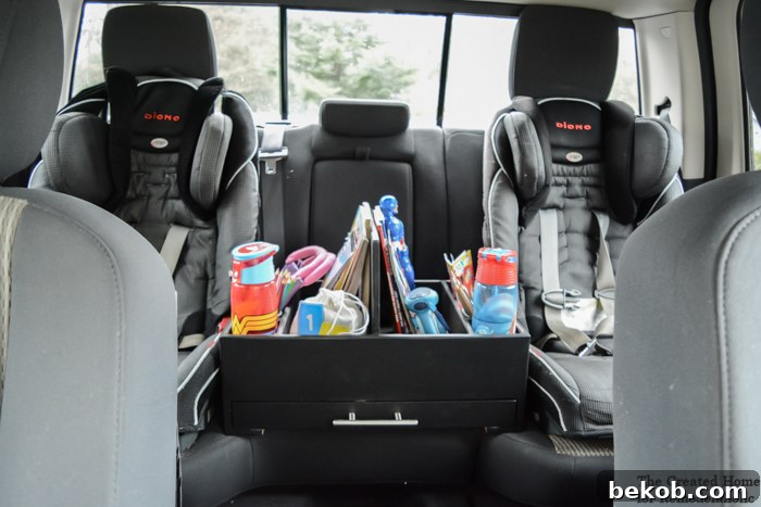 A well-organized backseat car organizer, designed to hold children's items neatly.