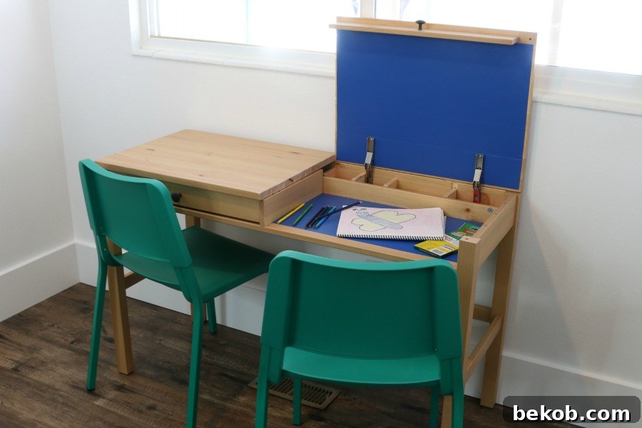 A space-saving double desk for kids, created from an IKEA furniture hack with hidden storage compartments.