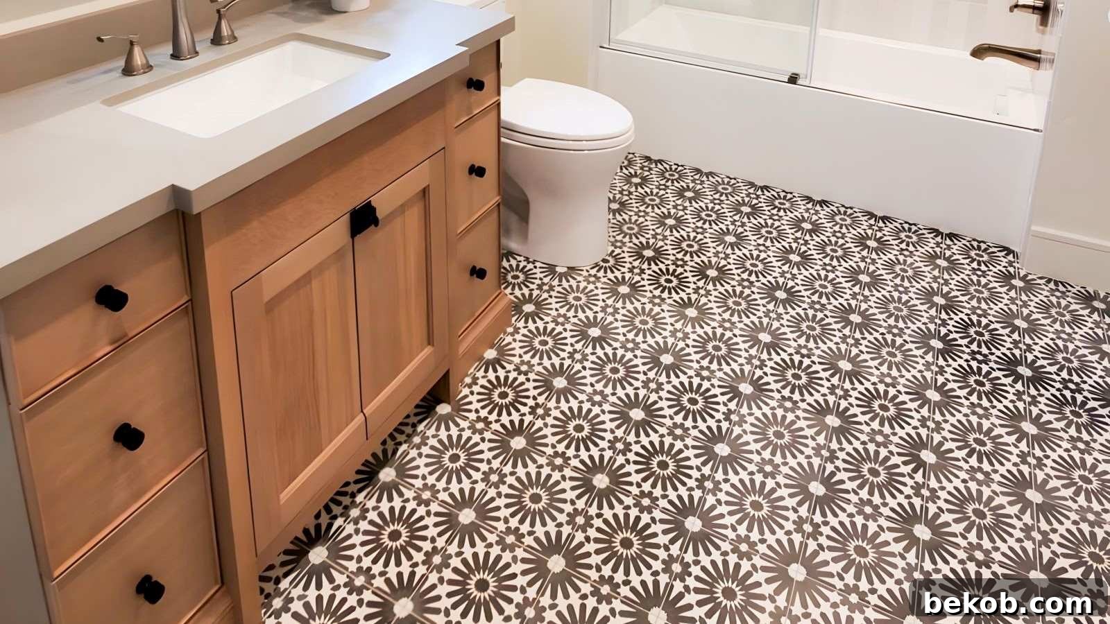 Bathroom showcasing bold patterned floor tiles in geometric designs