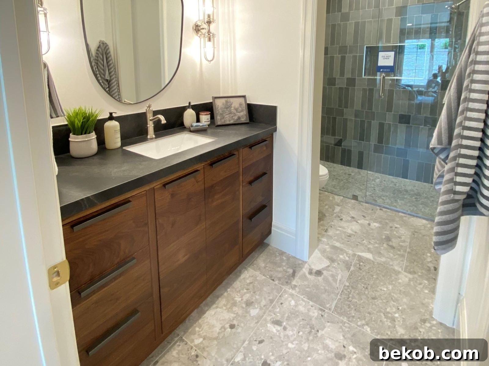 Bathroom design featuring earthy tones and natural wood elements