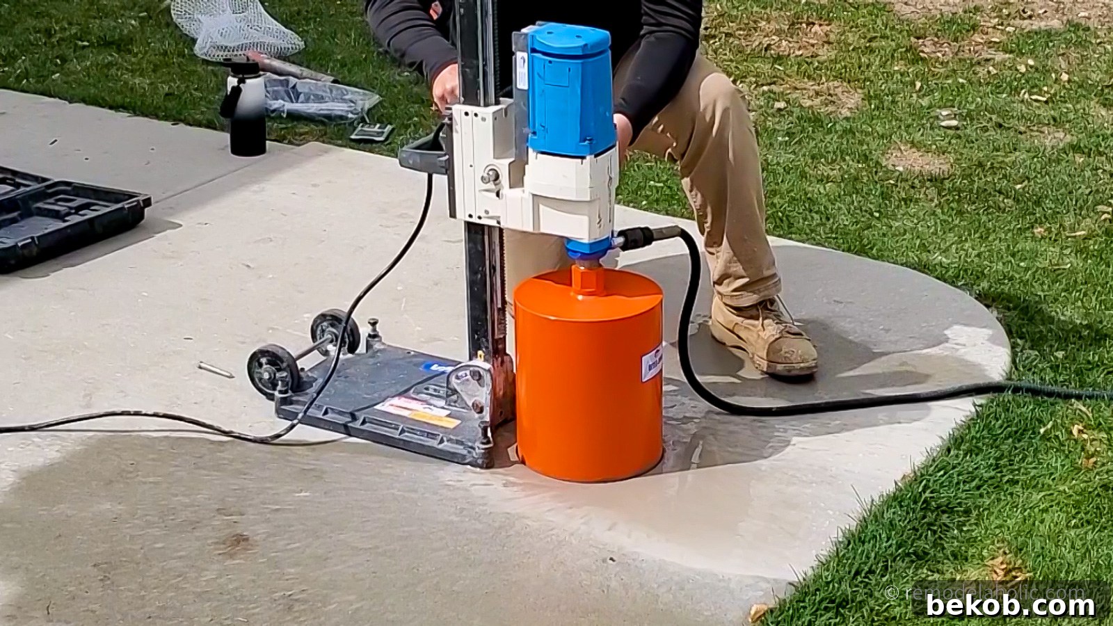 Process of cutting a concrete slab using manual tools.