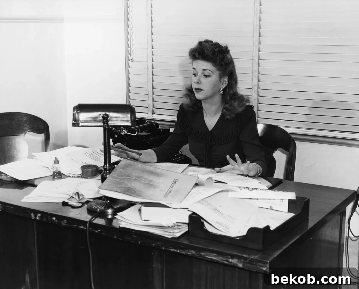 Cluttered Desk Lady Shutterstock 95079337