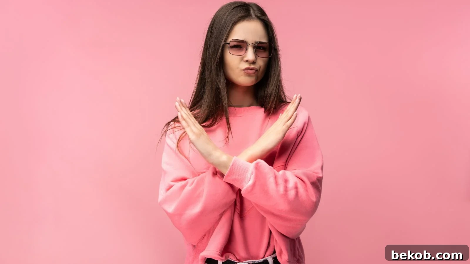 Trendy teen looking displeased, with 'No No' overlaid, representing items one would never allow in a personal, well-designed bedroom space.