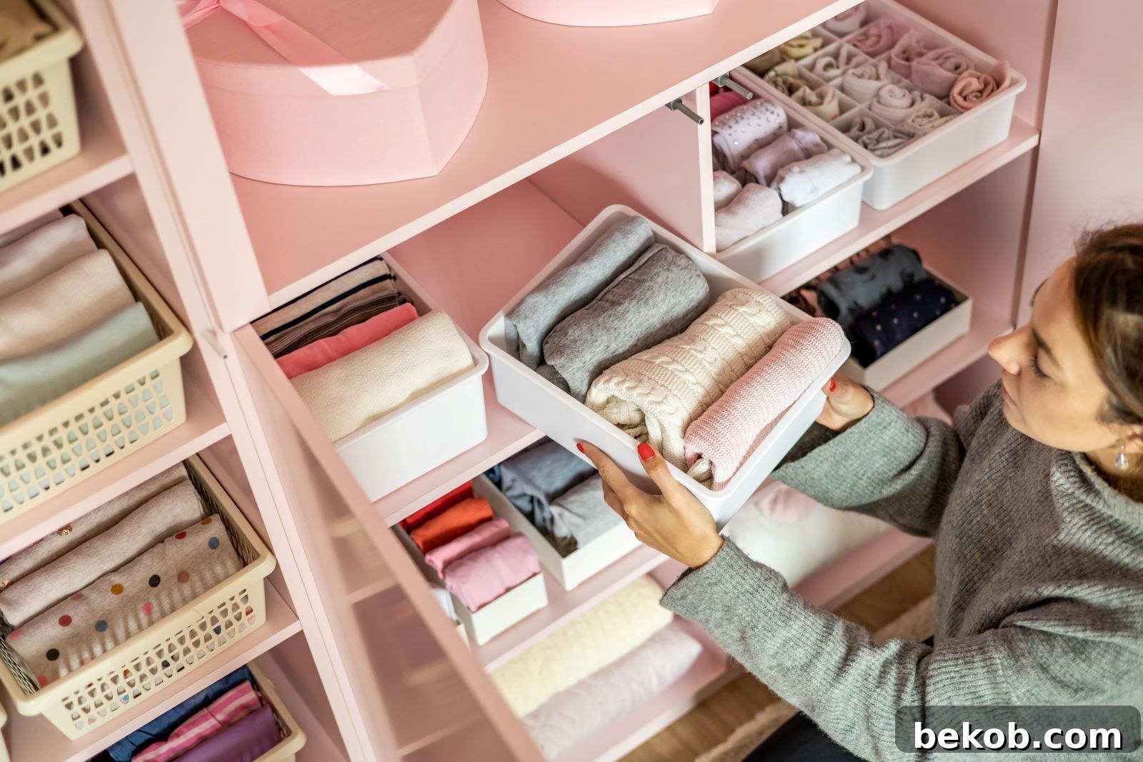Woman organizing a storage unit, highlighting the critical role of innovative storage solutions in maintaining a minimalist aesthetic.