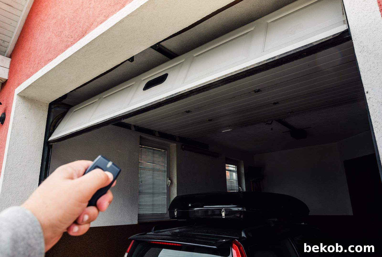 A modern garage door in motion, representing smart garage technology and automated features.