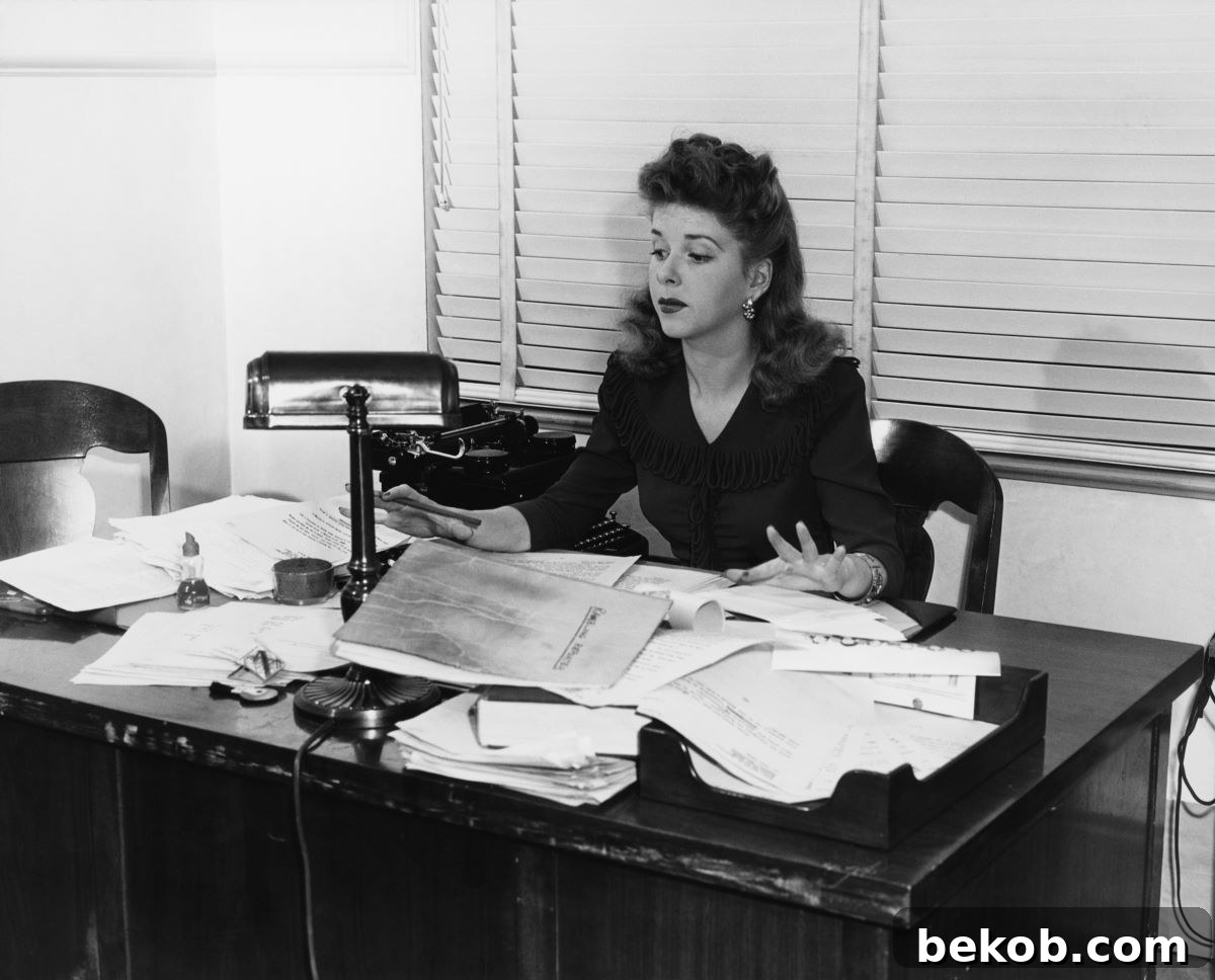 Cluttered Desk Lady Shutterstock 95079337