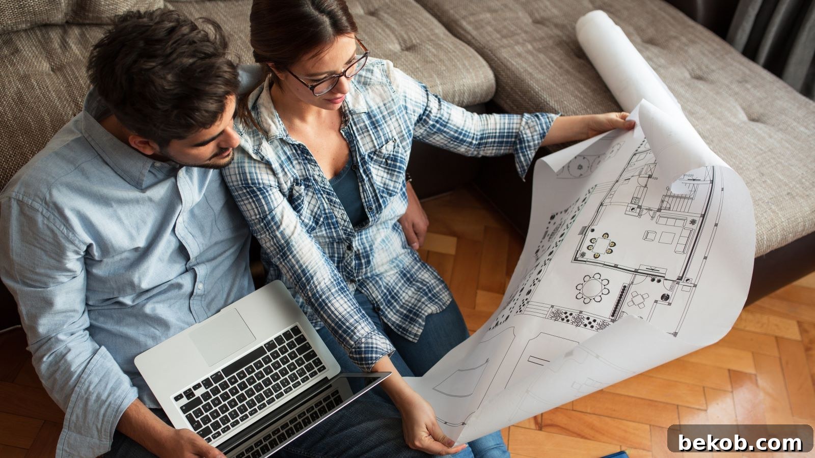 Couple Looking At Floorplan