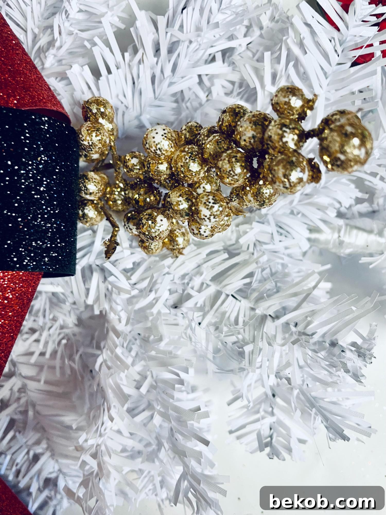 Dollar Tree DIY Christmas Swag for Front Door Add Gold Berry Picks, Remodelaholic