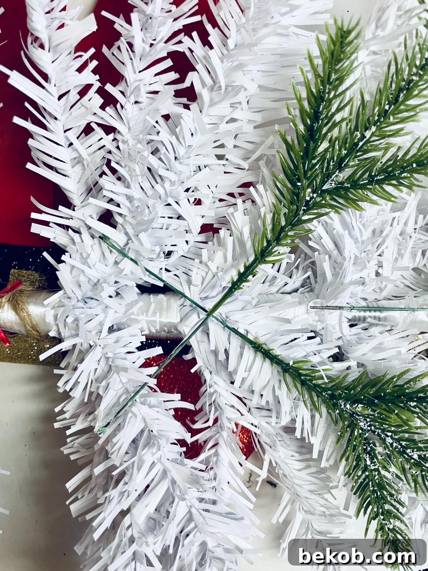 Dollar Tree DIY Christmas Swag for Front Door Add Pine to White Tree Swag, Remodelaholic