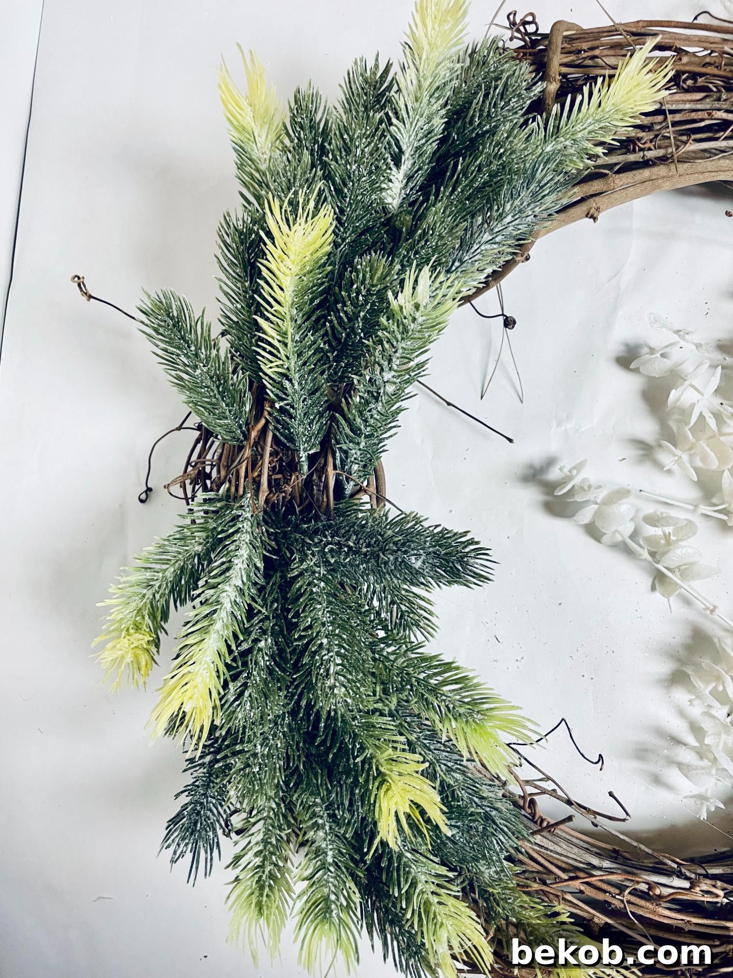 Affordable 30 Minute Dollar Tree Christmas Wreath 8 Simple DIY Dollar Tree Christmas Wreath Tutorial, Glue Pine Picks 3 Remodelaholic