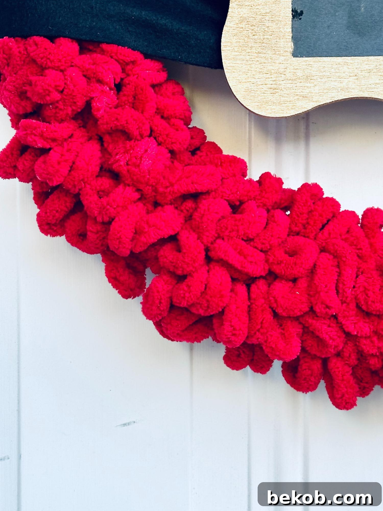 Close-up of Easy DIY Santa Belt Wreath Made with Loop Yarn and Fleece Scarf