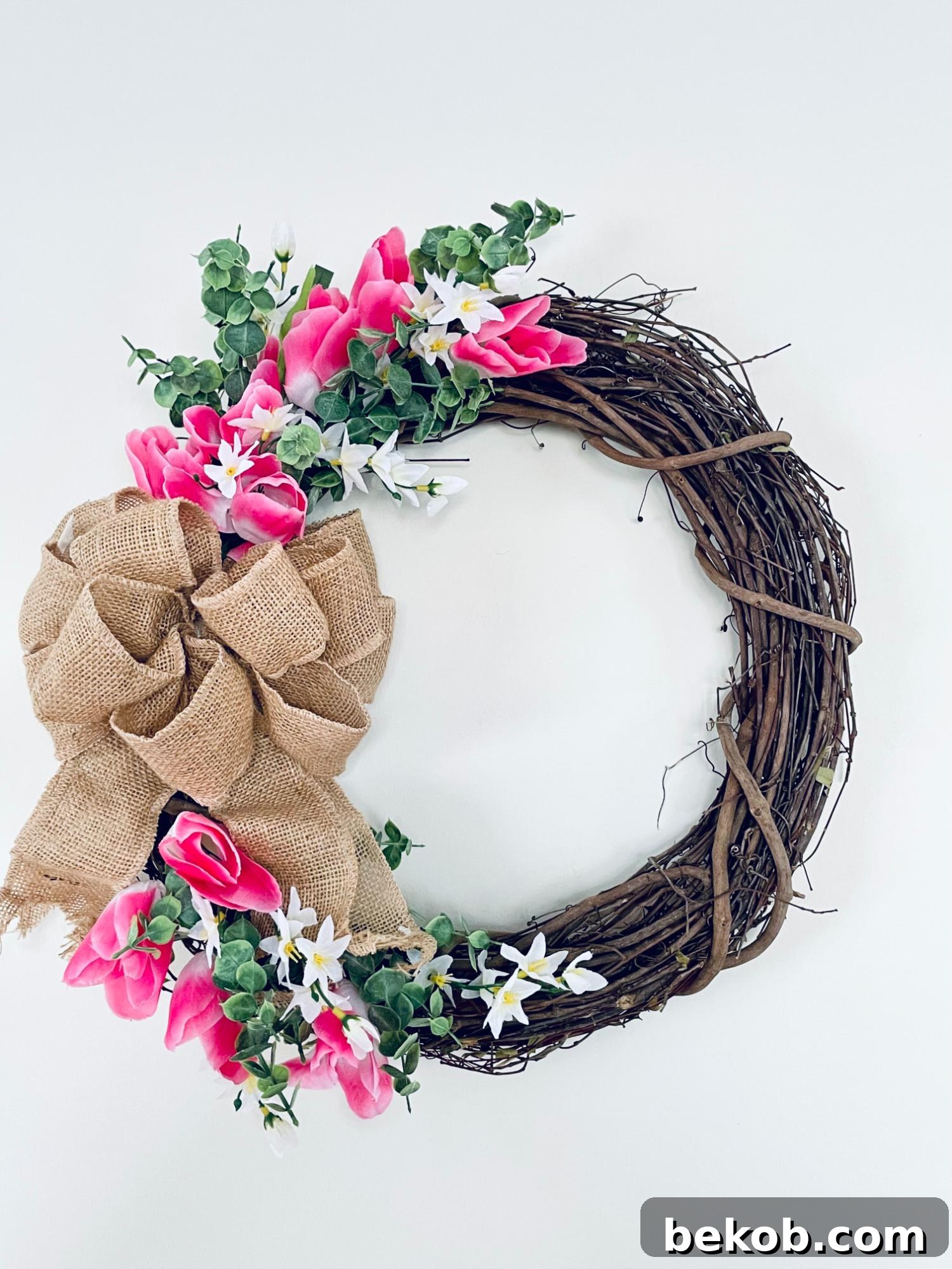 Beautiful handmade Dollar Tree farmhouse spring tulip wreath on a front door