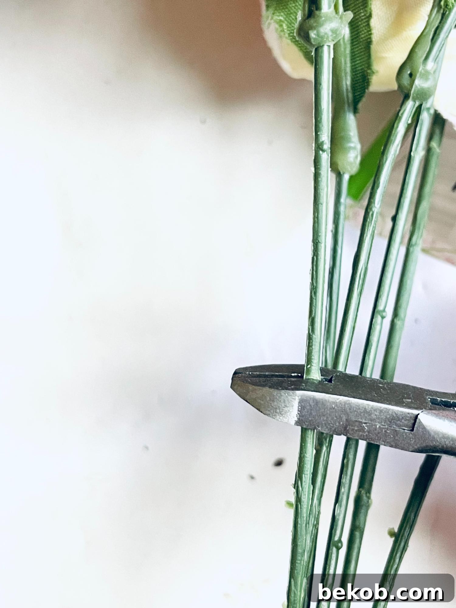 Trimming faux flower stems for DIY tulip wreath