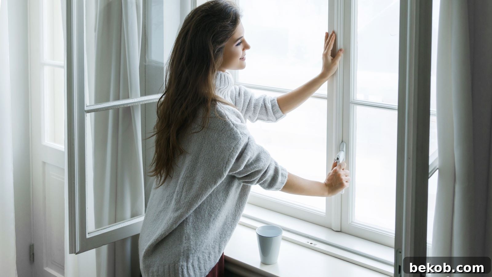 15 Simple Secrets to a Continuously Inviting Home Scent 14 Woman Looking At The Window