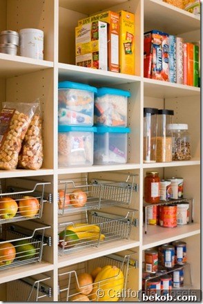 Well-organized custom closet with shelving and hanging space