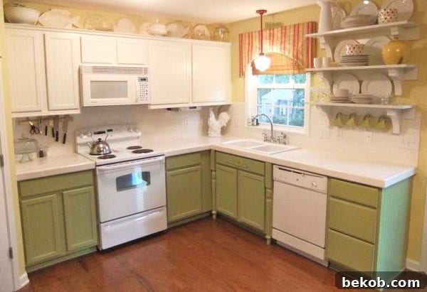Before photo of kitchen cabinets, originally green, transitioning to gray and white