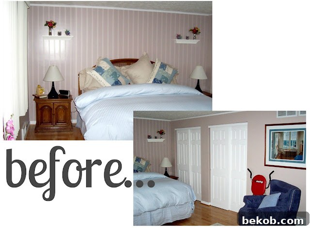 View of the black and white master bedroom showing a dresser and window