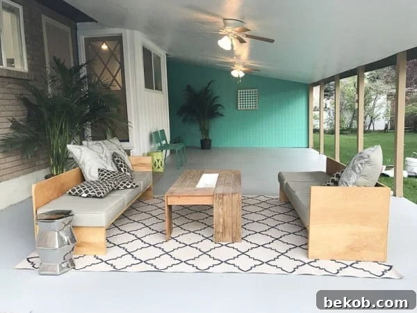 Painting A Patio With UGL Epoxy Floor Paint @Remodelaholic 32 - A vibrant and inviting painted concrete patio transformed into a stylish outdoor living space.