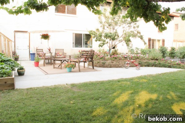 Finished Concrete Patio with Furniture and Flowers