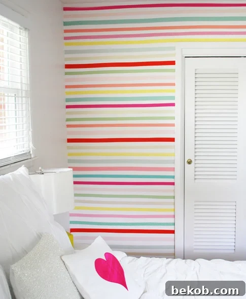 Chic Striped Washi Tape Accent Wall by Ann Kelle, transforming a neutral wall with vertical stripes