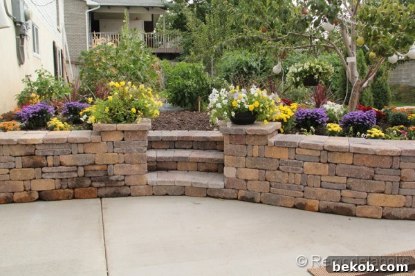 A wide shot of the refreshed patio flower garden, demonstrating the overall design and plant placement