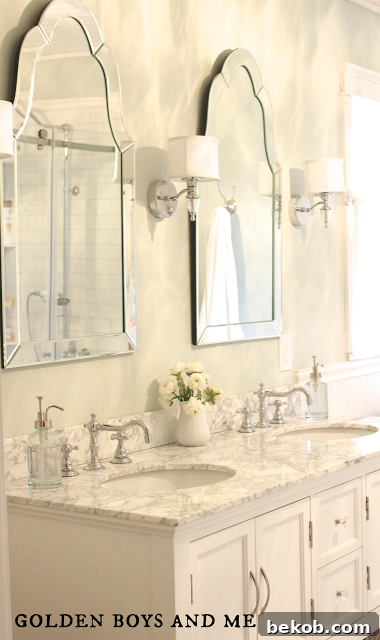 Double vanity with two curvy mirrors, elegant master bath remodel