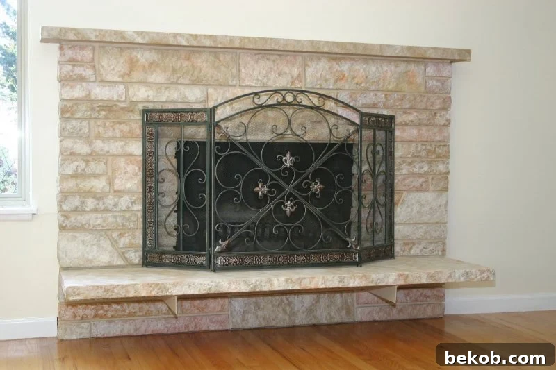 Restored Stone Fireplace, Showing Removal of Old Paint from Brick