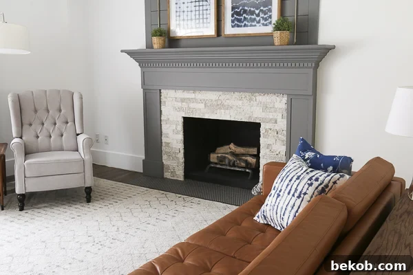 After: DIY Fireplace Remodel with Modern Gray Mantel and Airstone Fireplace Surround