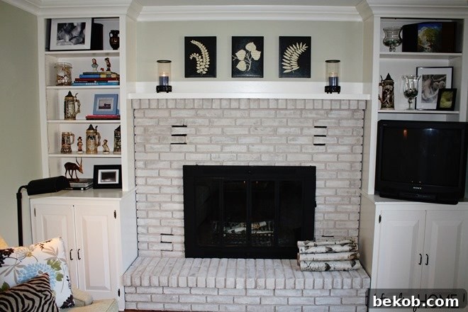 Painted Brick Fireplace Makeover with Whitewash and Built-Ins by Finding Home