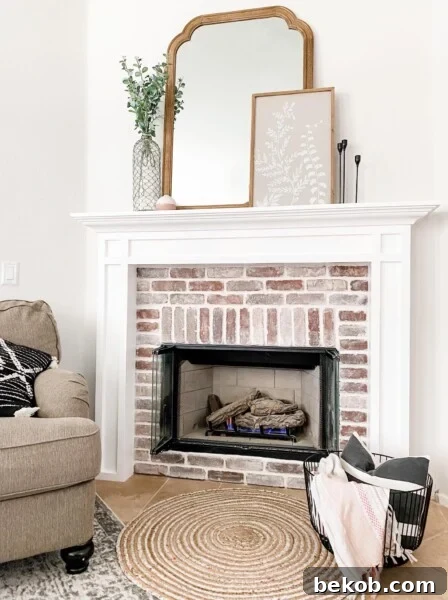 DIY Brick Fireplace and White Mantel by Living In Laundry