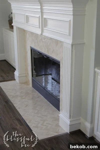 Fireplace Mantel and Tile Face Reface with White Marble by The Blissful Bee