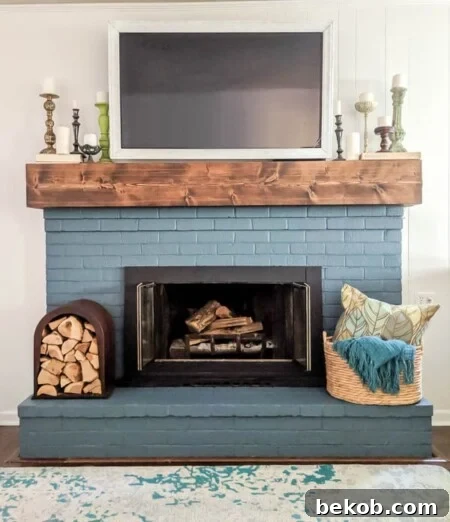 Blue Painted Brick Fireplace with Rustic DIY Mantel by Lovely Etc.