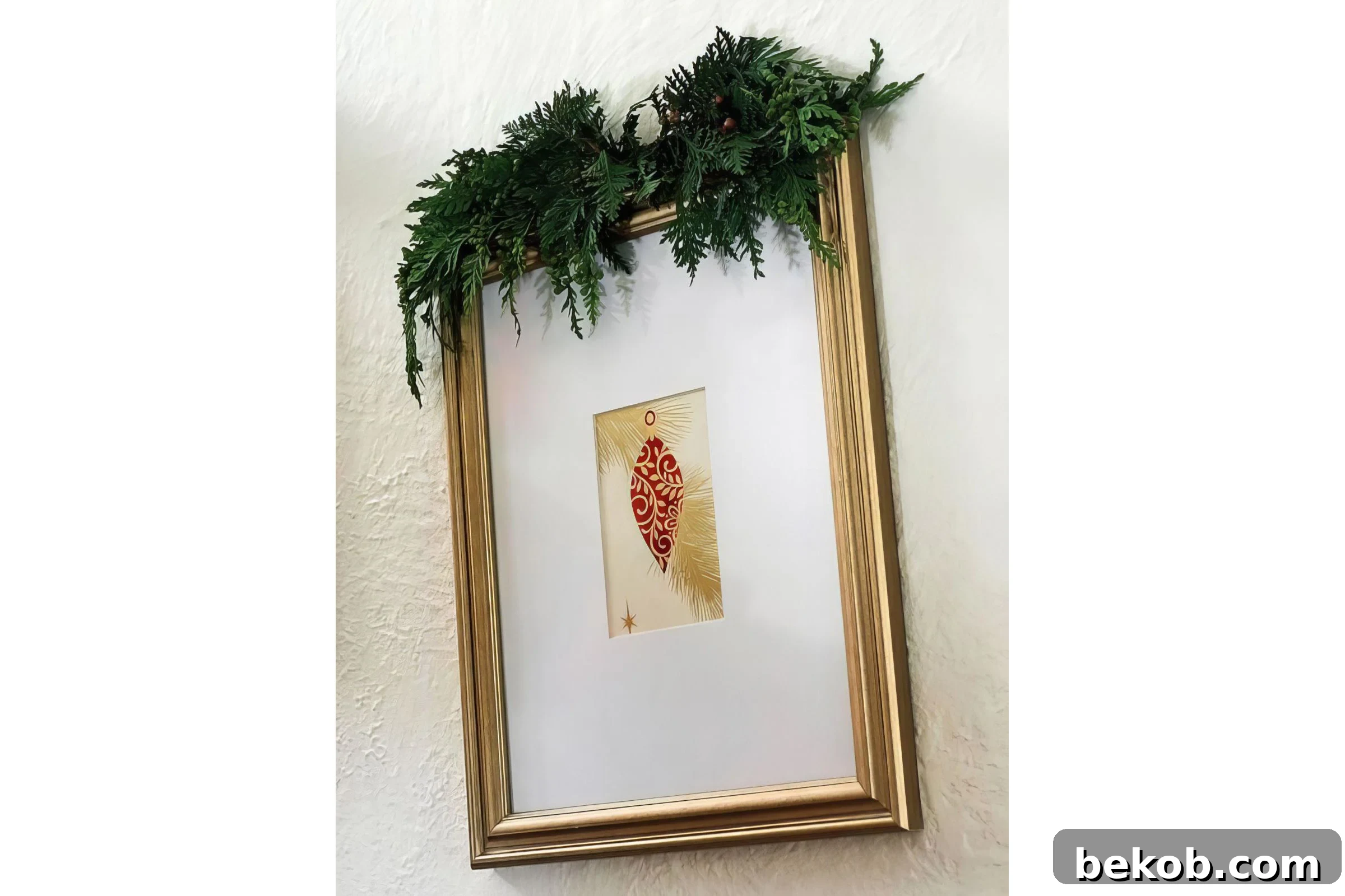 Fresh Evergreen Sprig On Top Of A Picture Frame BHG Via @Remodelaholic 032942 Copy