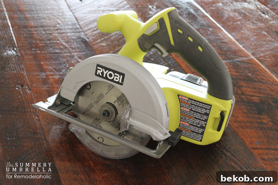 A circular saw cutting through a piece of wood.