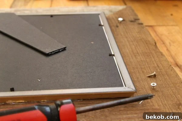 Adding hanging hardware to the barn wood frame