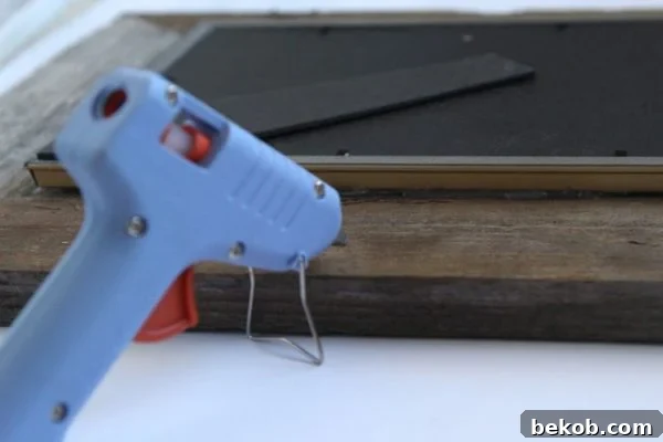 Attaching the picture frame to the barn wood frame