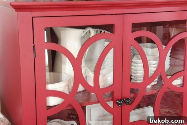 Sauder Cabinet filled with white dishes, adding functionality and style