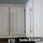 Kitchen cabinets after. A close-up of freshly painted kitchen cabinets, demonstrating a budget-friendly renovation technique.