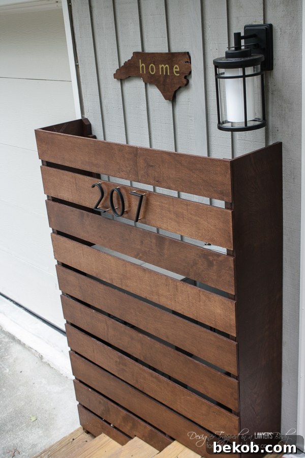 Behind that beautiful wooden screen hide ugly utility boxes! Learn to build this and install this (removable) DIY utility box cover on your home's exterior to significantly improve curb appeal.