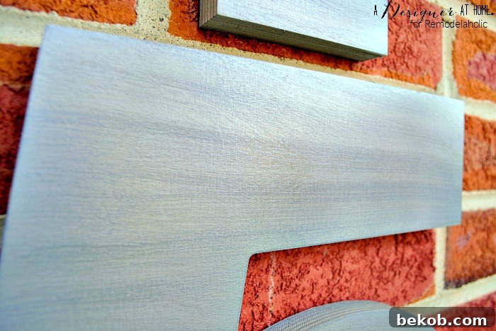 Detailed technique for achieving a realistic faux brushed nickel finish on wood, perfect for modern DIY projects.