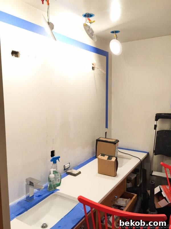 Bathroom vanity with new Symmons faucet and old lighting