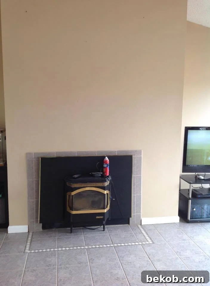 Catherine's non-functional fireplace, a design challenge ripe for transformation.