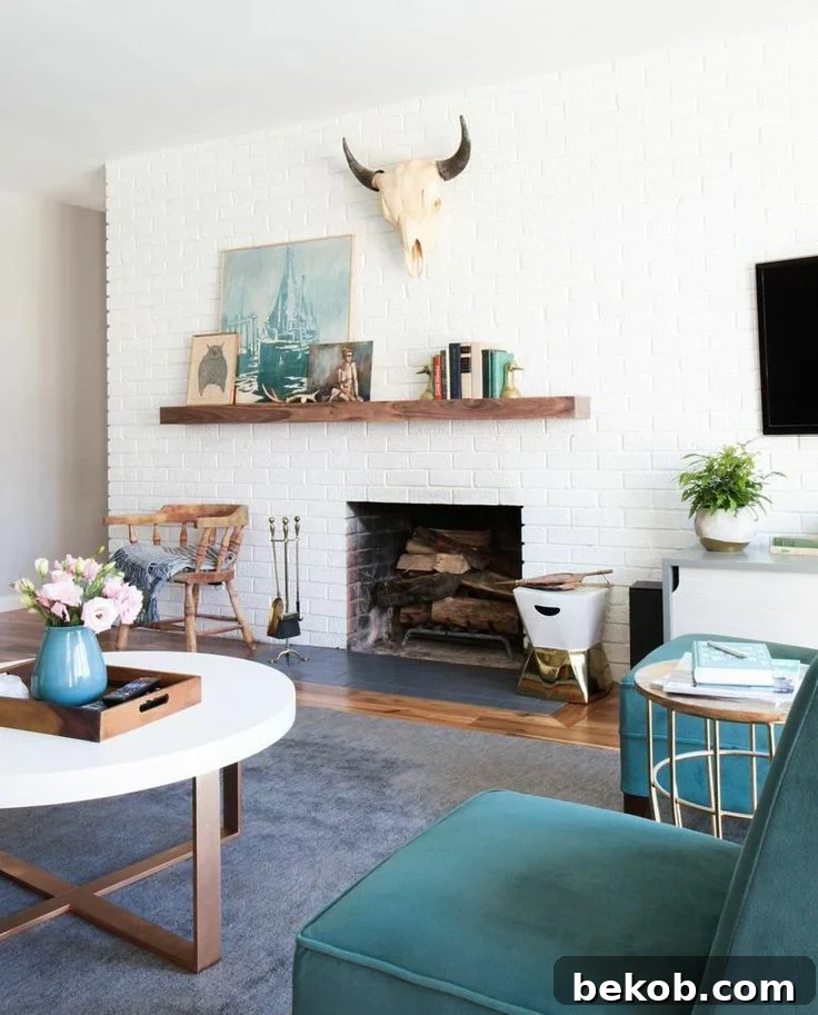 Off-center fireplace with white brick, wood mantel, and bold artwork for a modern yet inviting atmosphere