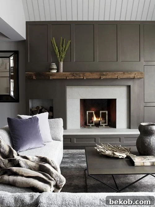 Stylish asymmetrical fireplace design with a dark accent wall and minimalist mantel