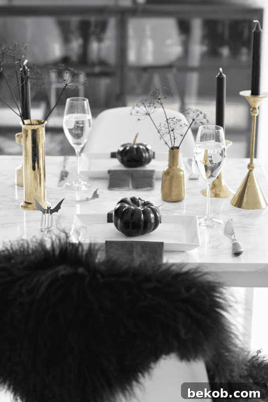 Stunning Pumpkin Centerpieces: Elevate Your Fall Table 17 Black and gold halloween tablescape